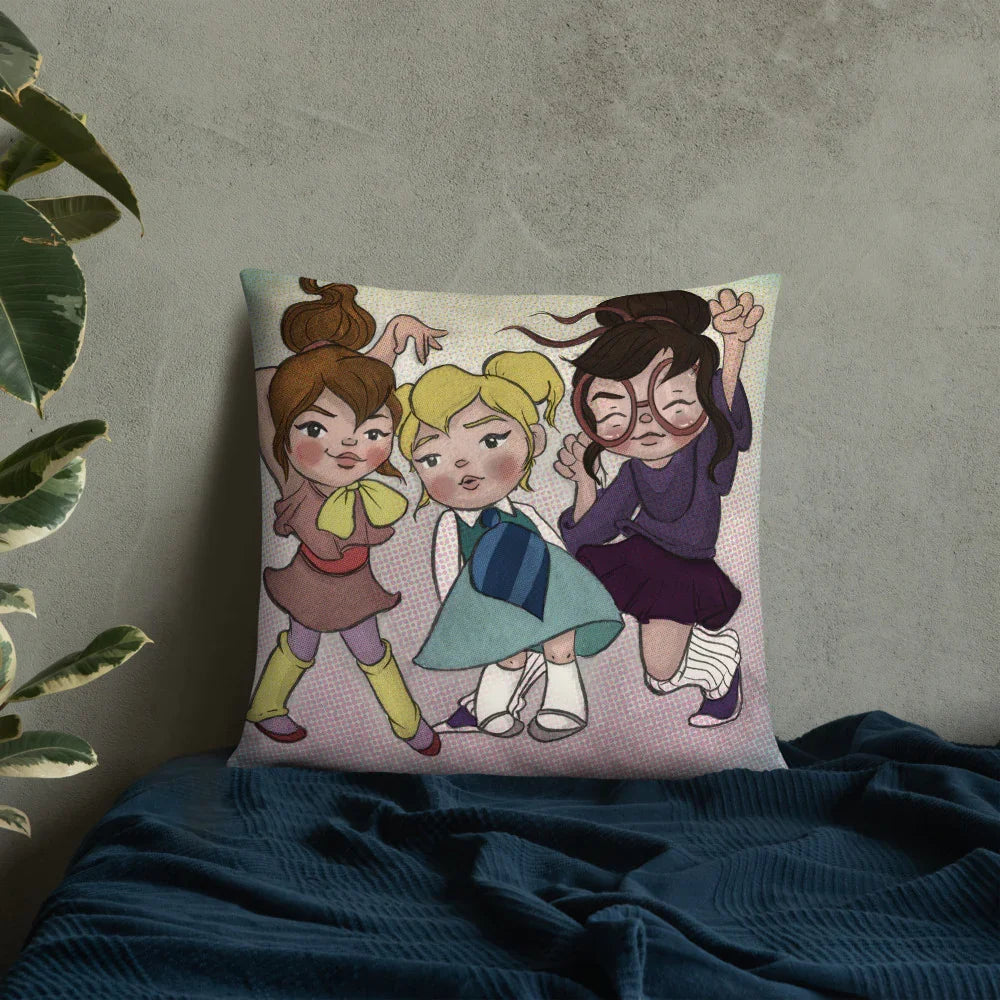 Throw pillow with whimsical illustration of three playful girls, cartoon style, on a bed.