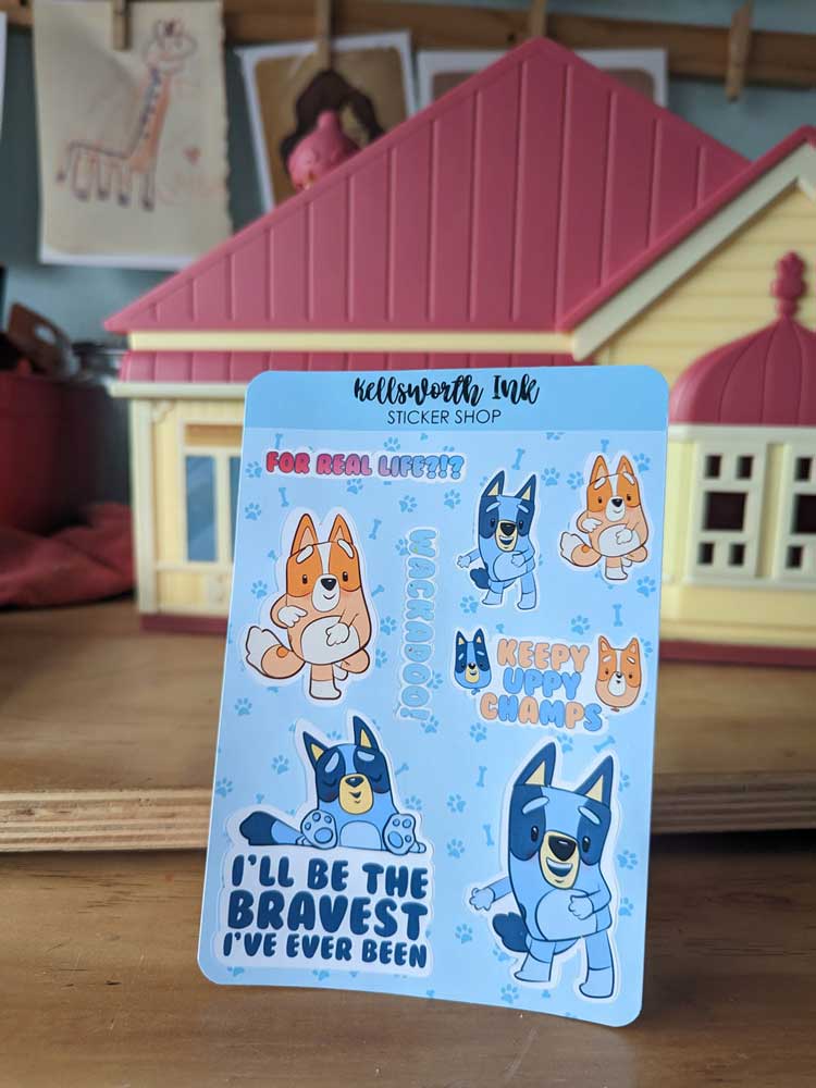 Sticker sheet of cartoon blue and orange dogs